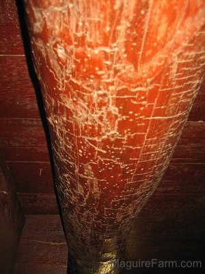 Close up - Old Basement Beam with axe marks in the wood
