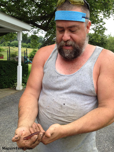 Bob with a Salamander and wearing a blue sweat head band