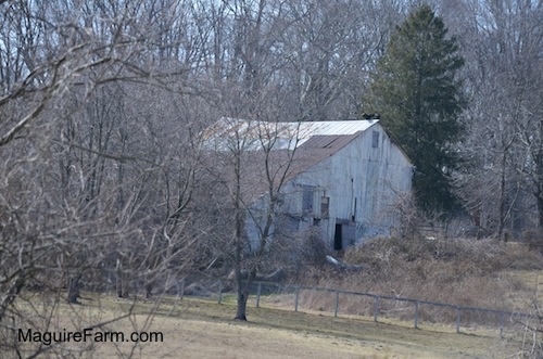 The Outside of a white barn.